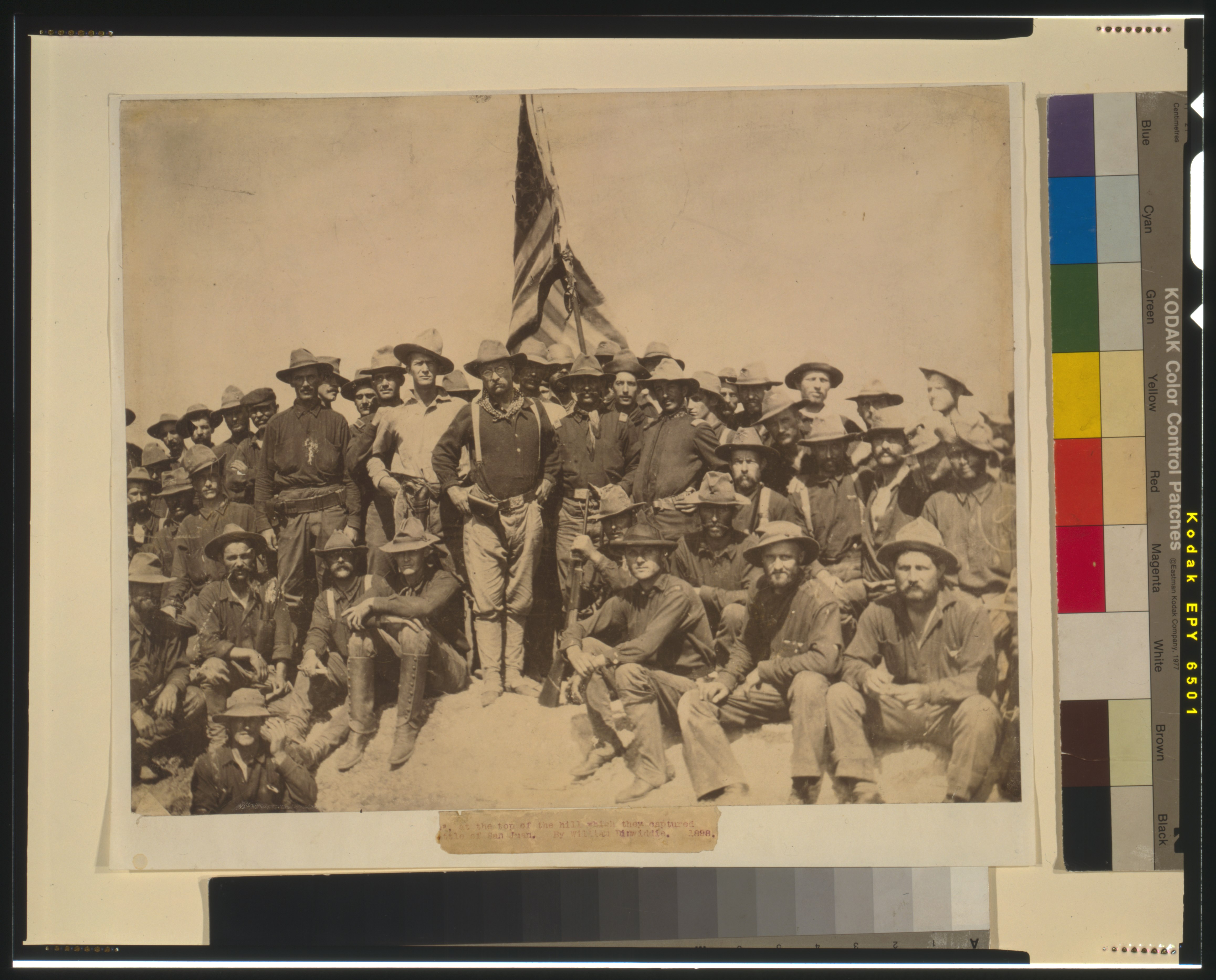 Colonel Roosevelt and his Rough Riders at the top of the hill